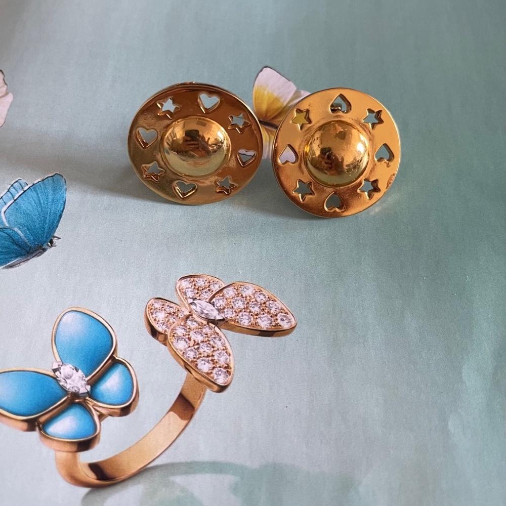 Carolee Gold Tone Center Round Clip Earrings with Cot Out Stars and hearts